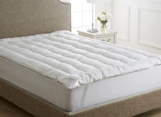 adding a soft mattress topper to a firm mattress