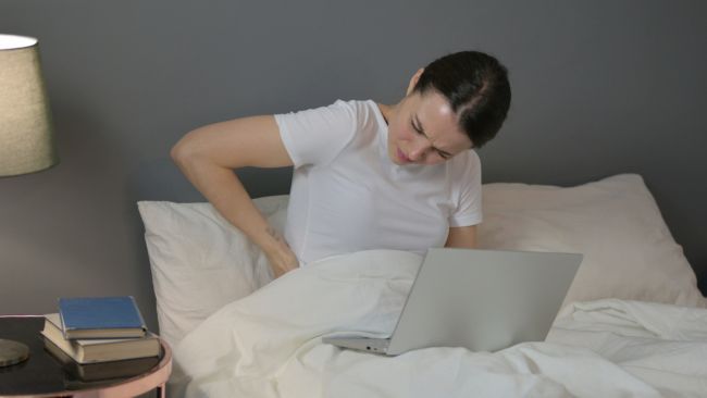 back pain from sleeping on two mattresses stacked on top